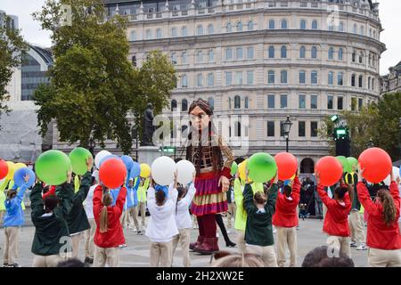 London, UK. 24th October 2021. Little Amal celebrates her 10th birthday in Trafalgar Square. Stock Photo