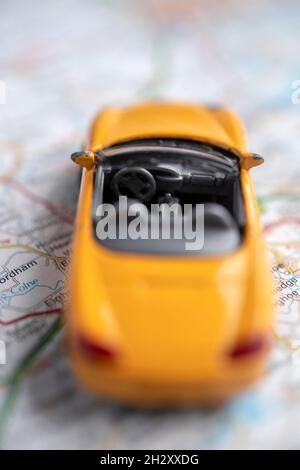 Toy car on a road map Stock Photo