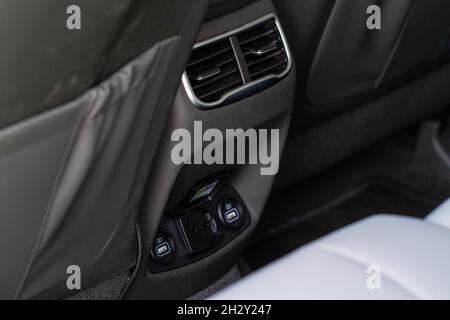 12V and 220v power outlet socket in the car. Opened sockets. Stock Photo