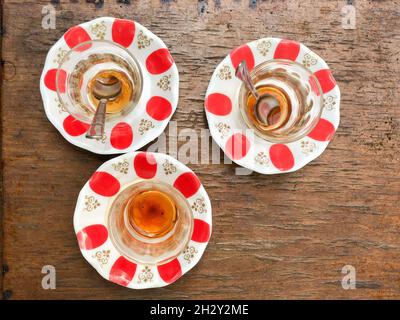 closeup empty and dirty Turkish tea glasses on the wooden table with copy space Stock Photo