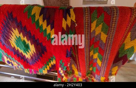 Close-up photo of a traditional Romanian rug woven with specific motifs and very colorful Stock Photo