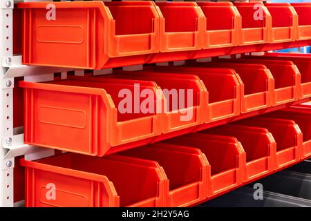 rows of multicolored plastic boxes for components Stock Photo