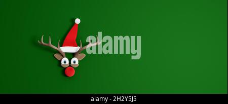 Reindeer with Santa Claus hat. Christmas Holidays concept with green copy space 3d render 3d illustration Stock Photo