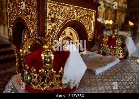 Traditional wedding crowns in a church. Wedding crown in church ready for marriage ceremony Stock Photo