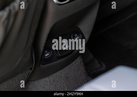 12V and 220v power outlet socket in the car. Closed sockets. Stock Photo