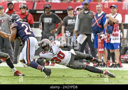 Tampa, United States. 24th Oct, 2021. Tampa Bay Buccaneers Dee Delaney (30) grabs for the legs of Chicago Bears' Khalil Herbert (24) during the first half at Raymond James Stadium in Tampa, Florida on Sunday, October 24, 2021. Photo by Steve Nesius/UPI Credit: UPI/Alamy Live News Stock Photo