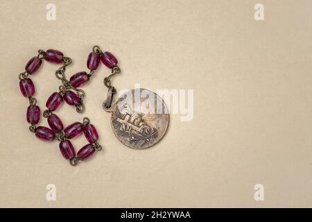 Old Rosary stored with other contents from a Korean War Soldiers pocket Stock Photo