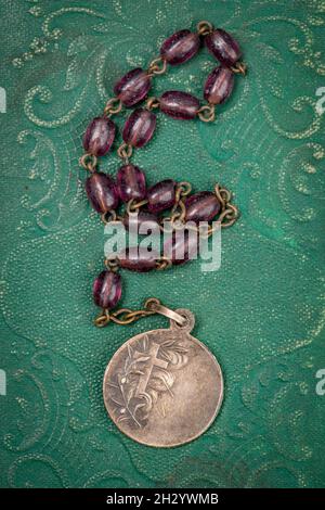 Old Rosary stored with other contents from a Korean War Soldiers pocket Stock Photo