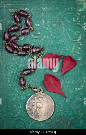 Old Rosary stored with other contents from a Korean War Soldiers pocket pocket Stock Photo