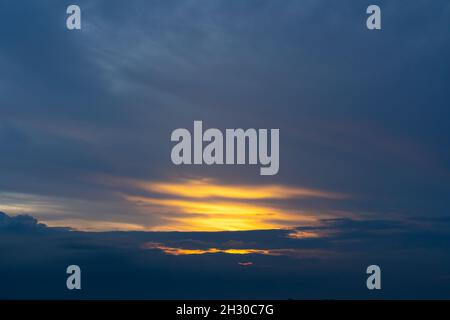 Sunset sky with dramatic clouds and beautiful dark blue cloud Stock Photo