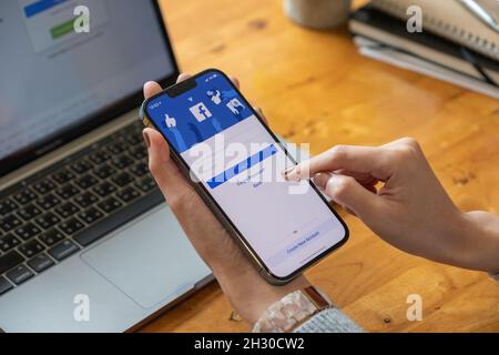 CHIANG MAI, THAILAND - OCT 17, 2021: Facebook social media app logo on log-in, sign-up registration page on mobile app screen on iPhone 13 Pro Max in Stock Photo