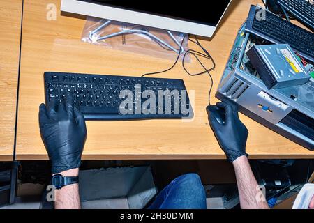 Computer technician working in workshop Stock Photo