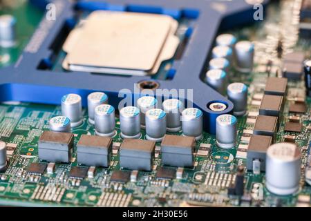 Electronic circuit board chips processor. Green PCB Component. Stock Photo
