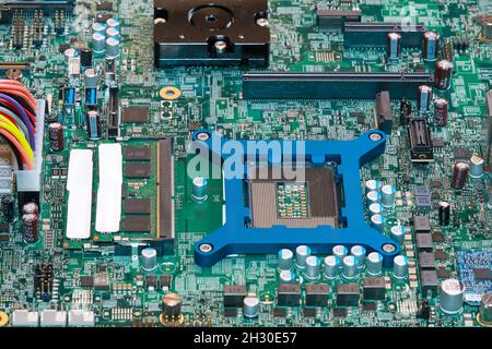 Electronic circuit board chips processor. Green PCB Component. Stock Photo