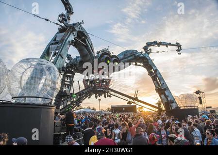 General view of the sun setting behind the Arcadia spider on day 4 of Glastonbury festival 2015, Worthy Farm, Somerset Stock Photo