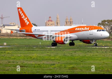 EasyJet Airline Airbus A320-214 (REG: G-EZTB) backtracking runway 31 for take off. Stock Photo