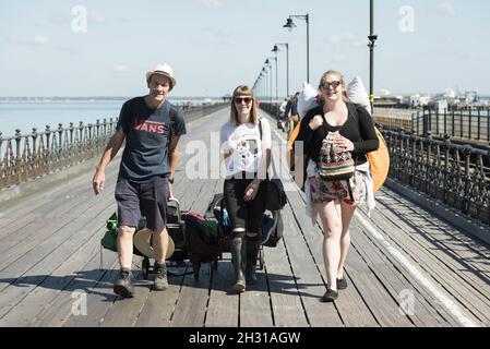 Festival goers arrive at Ryde Pier for the Isle of Wight festival at Seaclose Park, Newport. Picture date: Friday 22nd June, 2018. Photo credit should read: David Jensen/EMPICS Entertainment Stock Photo