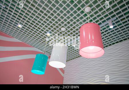 Multi-colored stylish lamps on the ceiling. Stock Photo