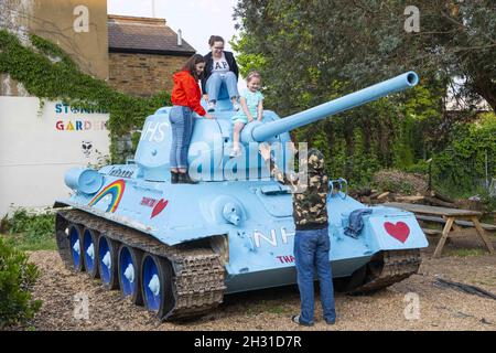 A T34 Soviet Tank is painted blue in support of the NHS during the  Coronavirus outbreak, in the Stone Garden, Mandela Way - London. Picture  date: Monday 27th April 2020. Photo credit