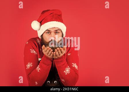 ready for party celebration. new year shopping idea concept. hipster enjoy the holiday. man in santa hat await christmas present. morning at Xmas Stock Photo
