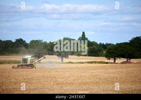 The modern combined harvester working a farm in Warrington, Cheshire. Stock Photo