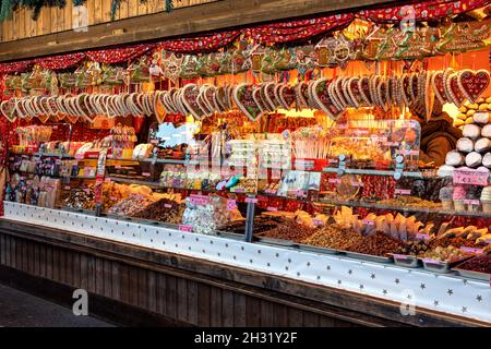 Heart-shaped gingerbread cookies and other traditional sweets on sale at famous Christmas market in Vienna, Austria. Stock Photo