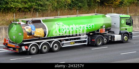 Side & back view Applegreen supply chain petrol fuel tanker filling station delivery lorry truck Hazchem warning sign on trailer driving UK motorway Stock Photo