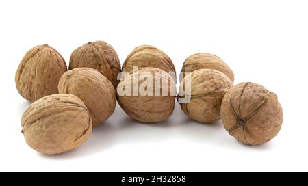 Several walnuts isolated on white background close-up. Stock Photo