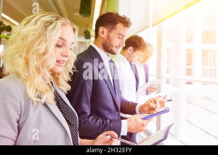 Young start-up business team having orientation in the office with clipboard and files Stock Photo
