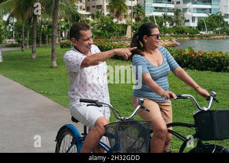 Older couple riding bicycles in the city Stock Photo