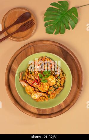 Stirred Fried seafood with Garlic, Pepper, Curry Powder and vegetable on dish Stock Photo