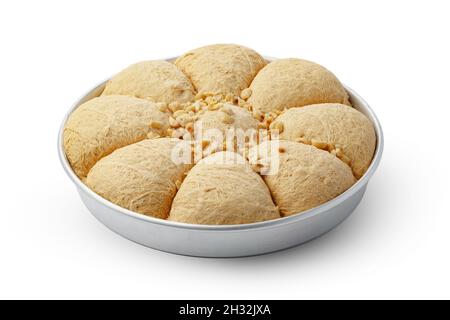 Turkish dessert halva in metal tray isolated on white Stock Photo