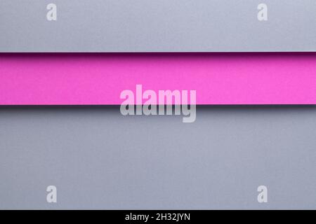 Abstract geometric composition background with gray and pink paper layers. Top view, flat lay Stock Photo