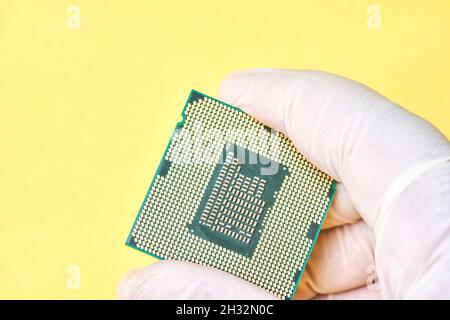 Macro-shot of computer microchip processor. Global chip and semiconductor shortage. Symbol of ongoing crisis in car industry. Concept of high demand Stock Photo