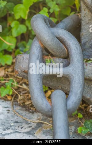 Heavy links of a thick anchor chain - close-up of a museum space in the city of Herceg Novi, Montenegro. Stock Photo