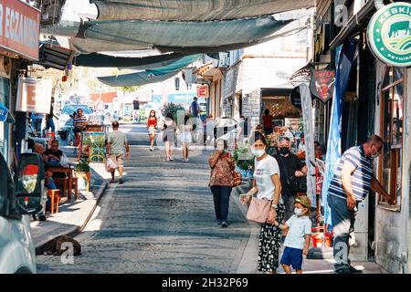 Urla, Turkey - September, 2021: Street, shops, cafes and people in Urla town in İzmir, Turkey. Stock Photo