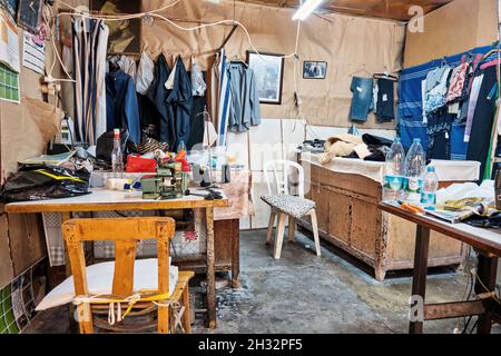 Urla, Turkey - September, 2021: Vintage tailor shop interior. The oldest historical tailor shop in Urla Izmir Turkey. Stock Photo