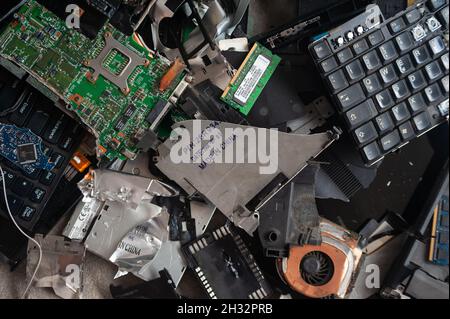 24.10.2021, Singapore, Republic of Singapore, Asia - Electronic waste (E-Waste) pile from discarded laptop computer components with circuit board. Stock Photo