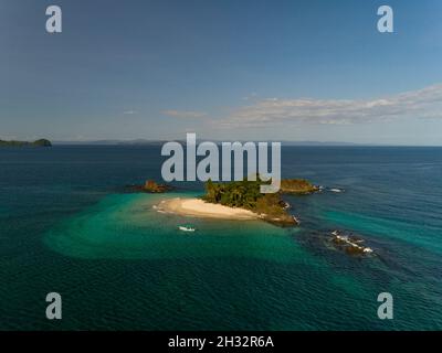 Great coral reef surrounds this little island (Granito De Oro), A place for snorkeling, scuba diving, kayaking, swimming, Coiba  National Park, Panama Stock Photo