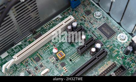 Woodville, Australia - October 15, 2021: Close-up top view of motherboard PCI and PCI Express slots installed in a small factor business desktop Stock Photo