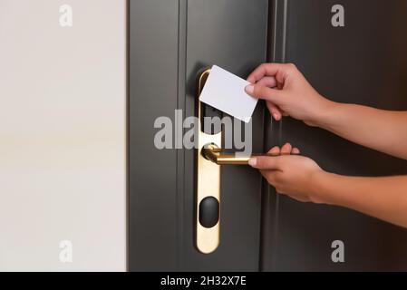 Opening a hotel room door with a magnetic key Stock Photo