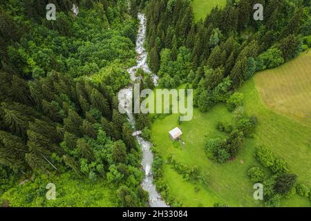 Aerial birds eye view showing epic Krimml waterfalls surrounded by big forest trees in mountains Stock Photo