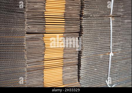 Brown cardboard, craft paper corrugated stacked for packaging Stock Photo