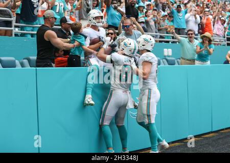 Miami Dolphins tight end Mike Gesicki (88) urges the fans to get