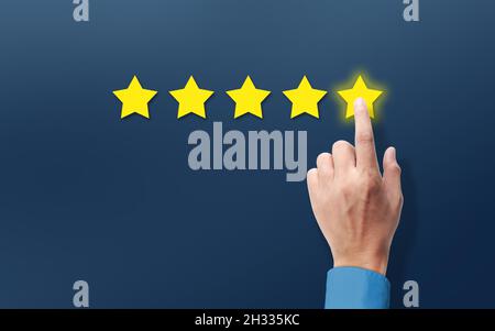 Customer satisfaction and satisfied Shopper with Positive Feedback. Hand Rating five stars review. Shiny Star and Customer Excellent  Service Stock Photo