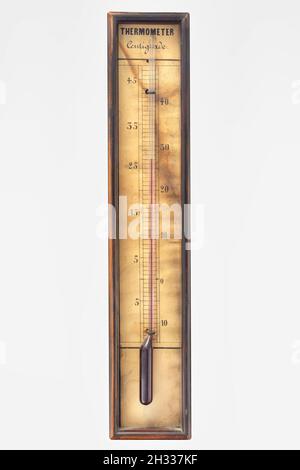 Vintage weathered thermometer isolated on a white background Stock Photo