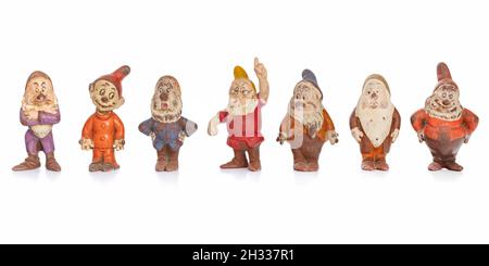 Studio shot of authentic weathered rubber figurines of Walt Disney Snow White and the Seven Dwarfs dated 1938 Stock Photo