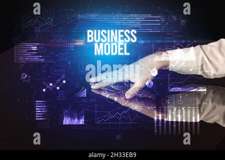 Businessman touching huge screen concept Stock Photo