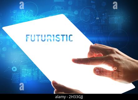 Hand holdig futuristic tablet , technology concept Stock Photo