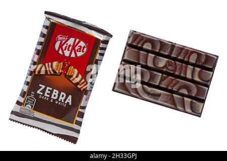 Bar of Zebra dark & white Kitkat Kit-Kat Kit Kat with chocolate removed from wrapper isolated on white background Stock Photo